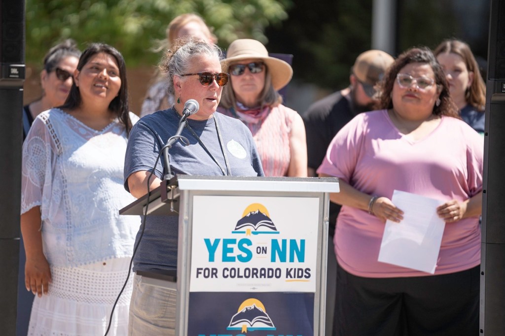 Kate Guasta Pacheck, president of the Pueblo County Education Association, speaks during a press conference in support of Colorado Proposition NN