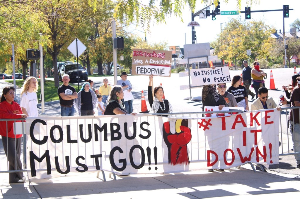 People protest the Columbus Day celebration