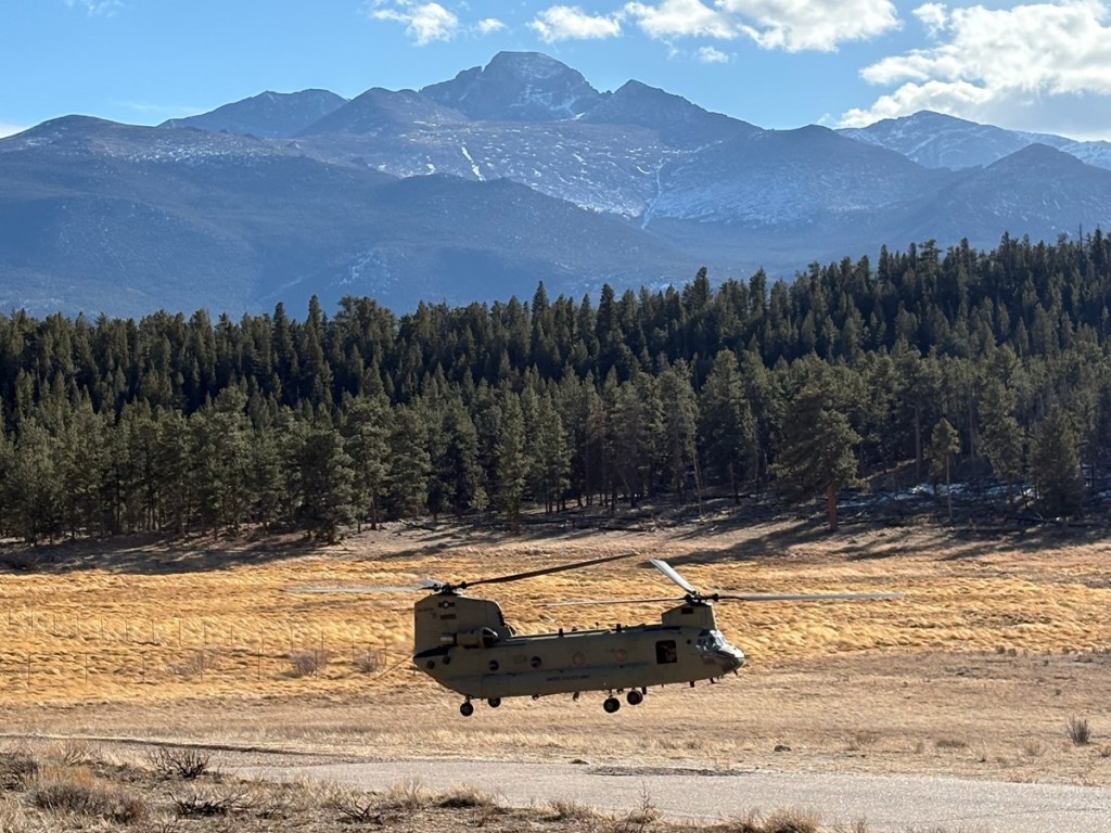 a helicopter lands at Rocky Mountain National Park
