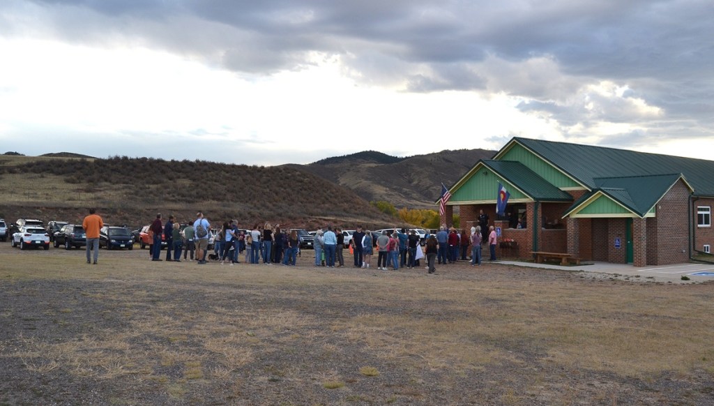 Residents line up at a listening session to speak about the potential closure of public schools